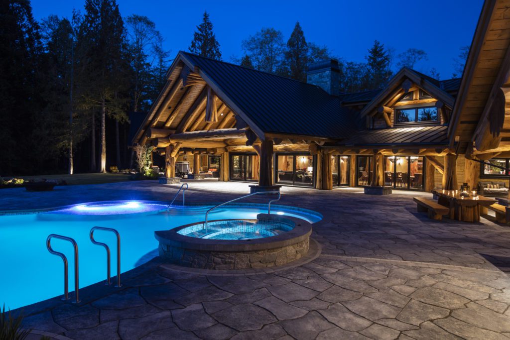 Landscaped backyard pool and outdoor living space in Vancouver by No Limit Landscaping